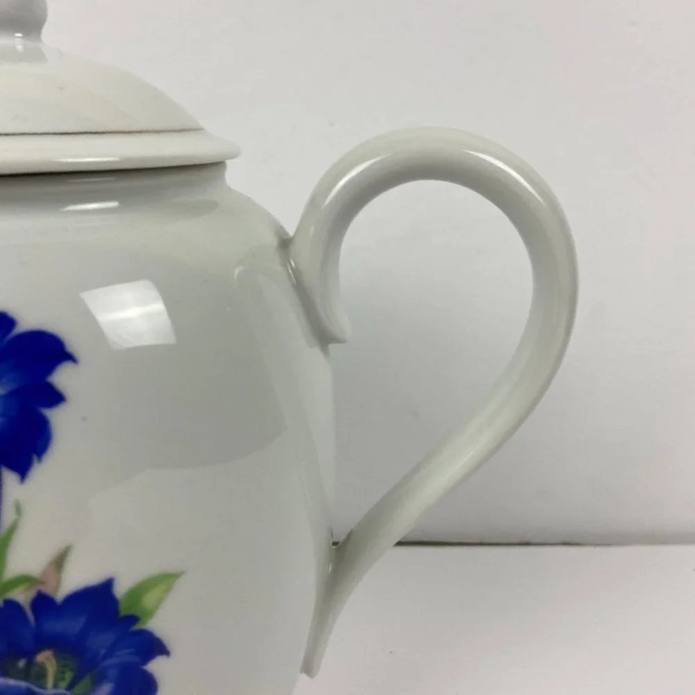 Vintage porcelain large tea pot with the floral decor